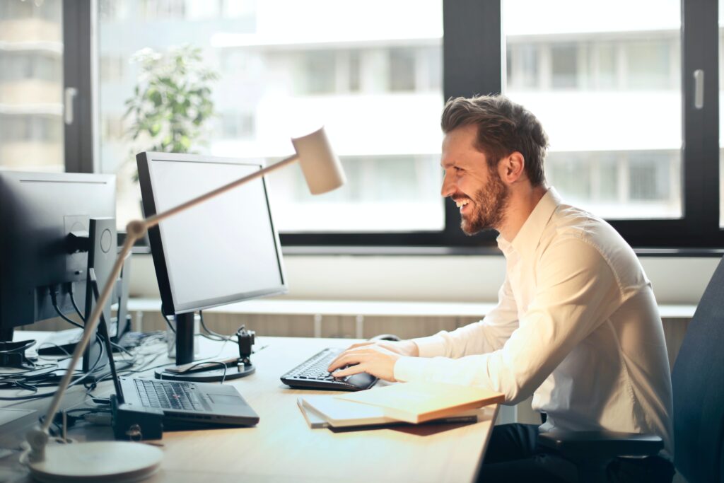 man computer desk